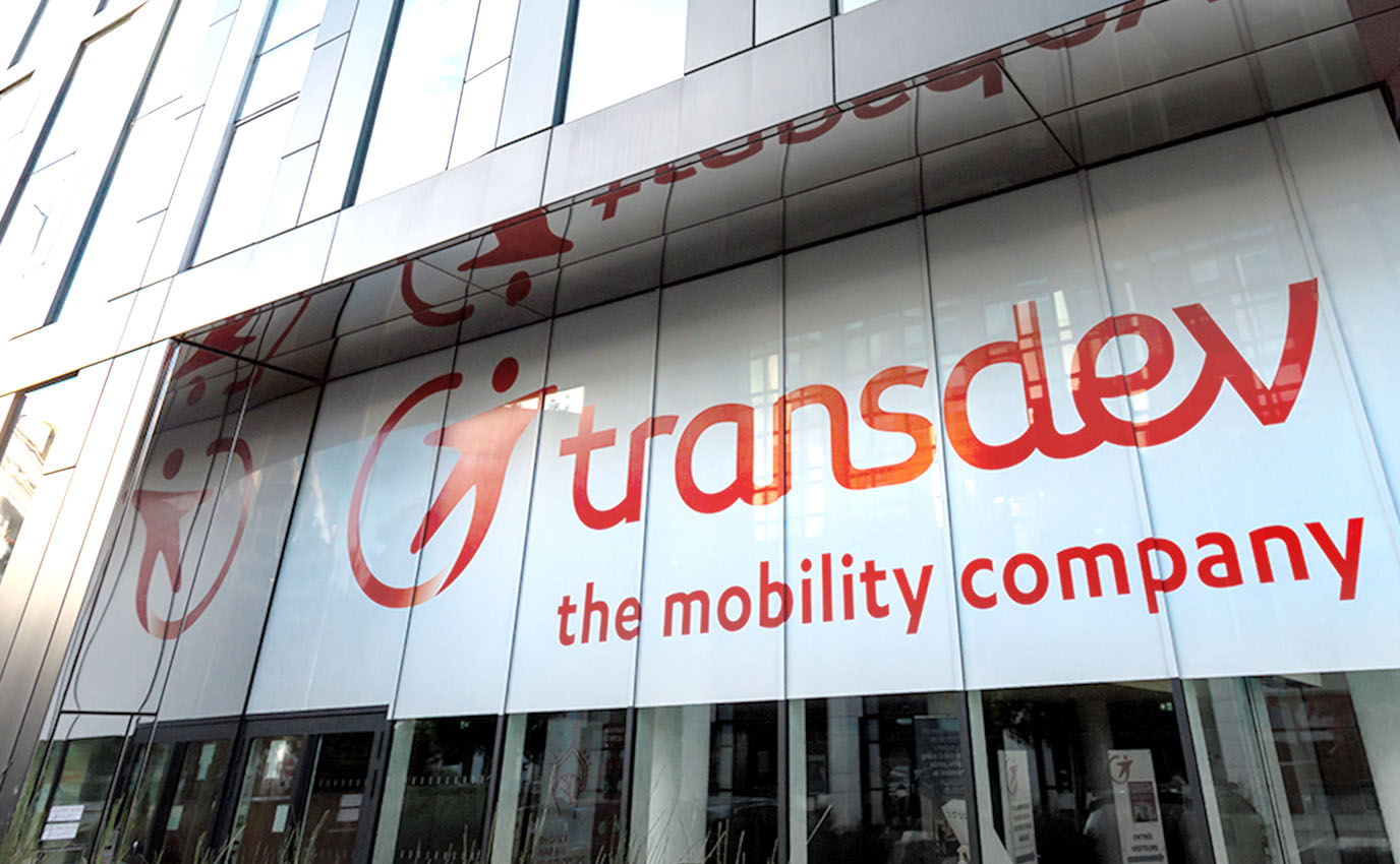 transdev logotype branding identite marque immeuble building marquage facade frappa